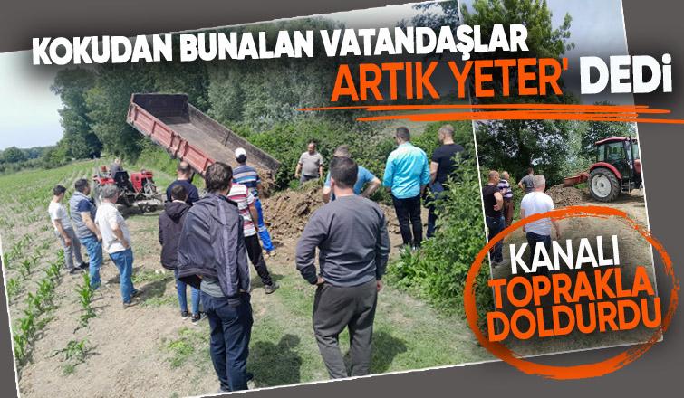 Akyazı'da kokudan bıkan vatandaşlar kanalı toprakla doldurdu