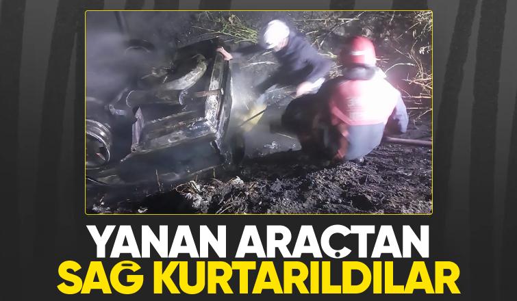 Takla atıp yanan araçtaki 2 kişi ölümden döndü