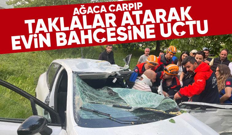 Sapanca'da taklalar atan otomobil evin bahçesine uçtu