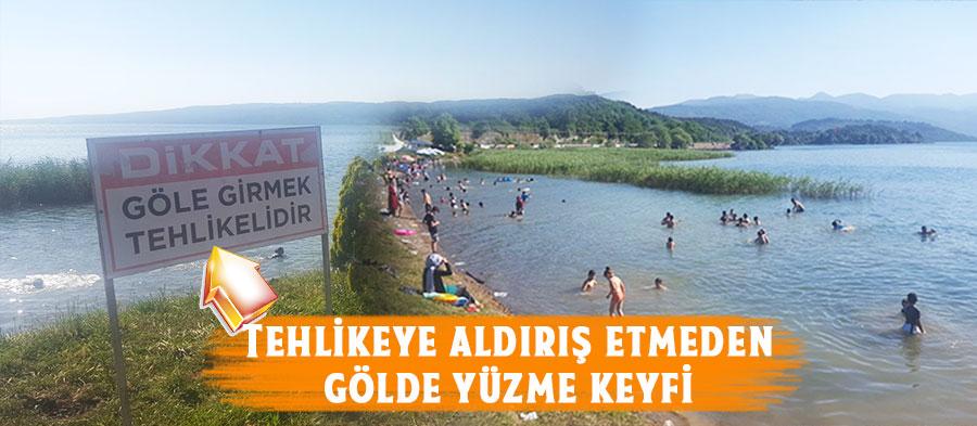 Sapanca Gölünde tehlikeye aldırış etmeden yüzüyorlar